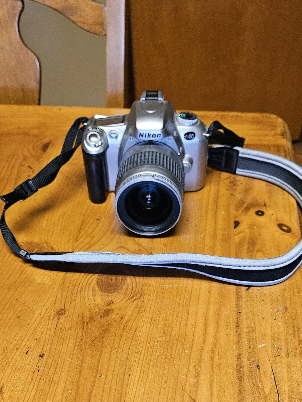 Nikon N55 35mm SLR Film Camera with Black Zoom Lens and Strap
